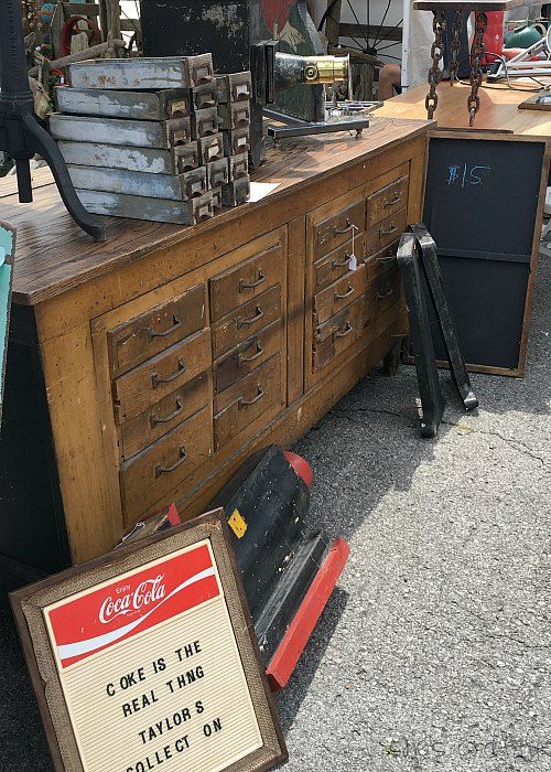 10 tips for success at the Nashville Flea Market - Nashville Tennessee Flea Market - large wooden store counter - coke sign