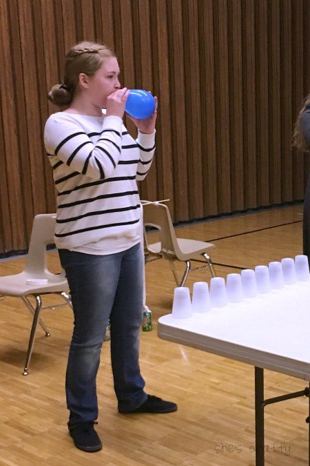 Minute to Win it games for party - blow it over balloons and cups