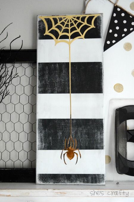 How to make a DIY Halloween sign with black and white stripes and gold spider